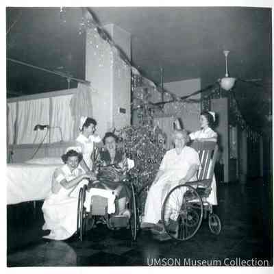 Three student nurses and two wheelchair patients at University Hospital