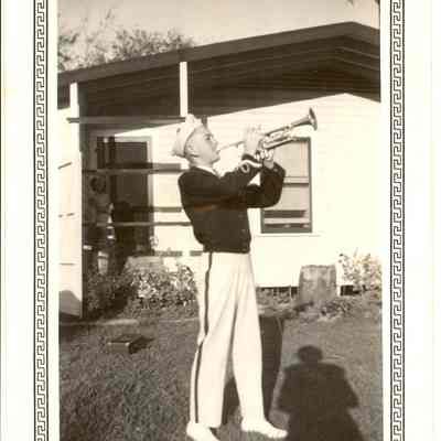 Trumpeter in front of Buiding