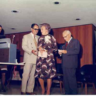 A color photo of Dr. Beutel and wife with Barnes and Rooke