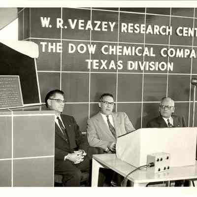 Dr. Beutel and two men in front of Veazey Research Center