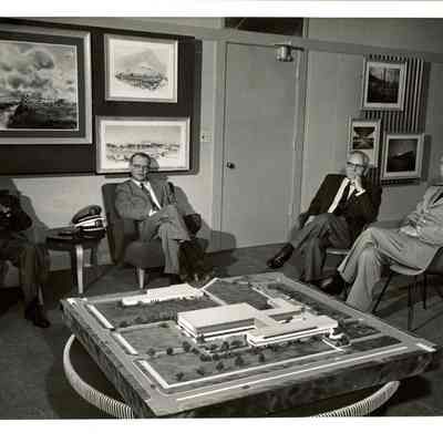 Dr. Beutel in his office with group of men