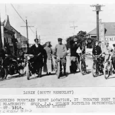 Group with bicycles and motorcycles