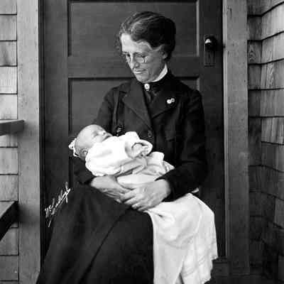 A nurse holds a baby
