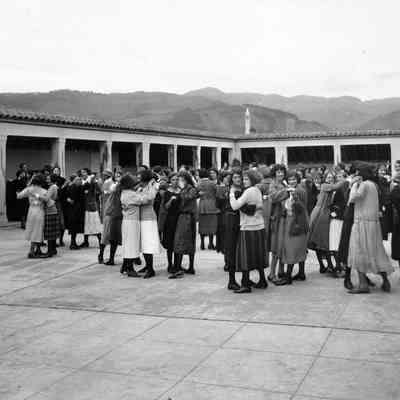 Students dancing in a courtyard