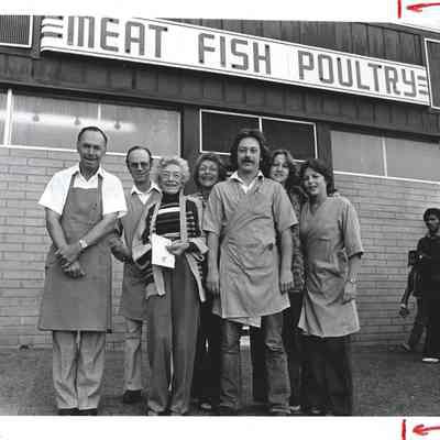 People in front of a meat market on Telegraph