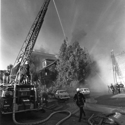 Fighting fire in building on Walnut Street