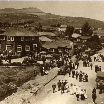Many pedestrians on unpaved road