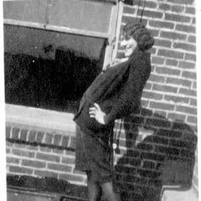 A woman poses outside the International Distributor Co.