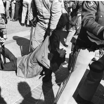 Police dragging rioter on Telegraph Avenue