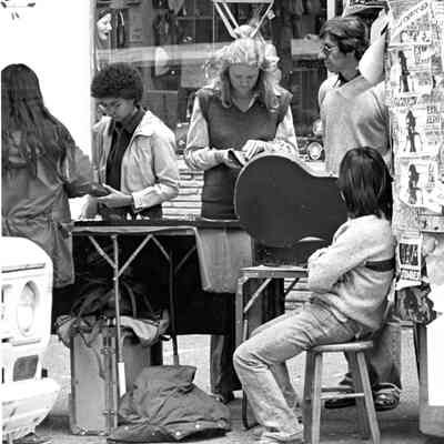 Street vendors and shoppers on Telegraph Ave.