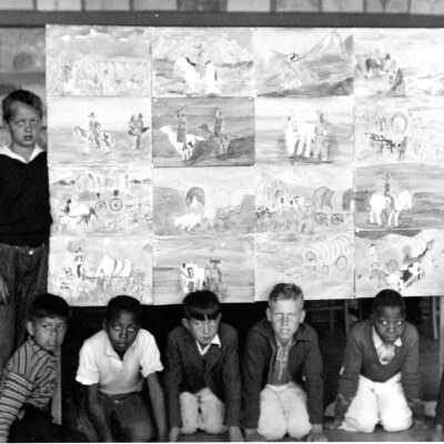Longfellow School students with art work.