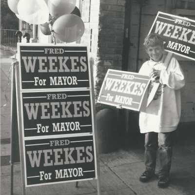 John Parman with Fred Weekes for mayor signs.