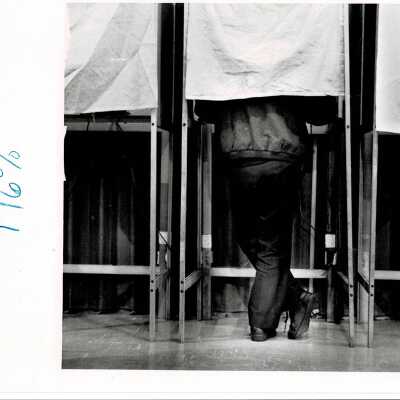 Man in voting booth.