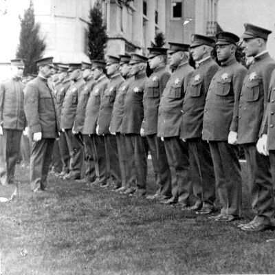 August Vollmer reviewing police force.