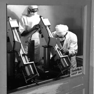 Lab technicians at ultraviolet machine