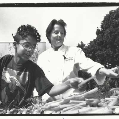 2011.060.440d: Chester King Vega. photog. Sorting carrots at Jefferson Elementary School, with second-grader Mateo Rooze. 1995.