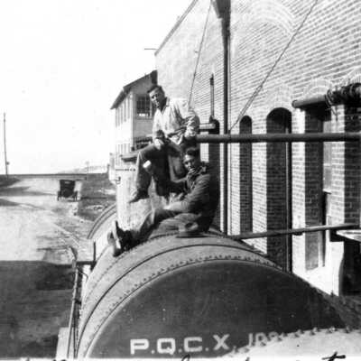 Joe and Frank loading tank car