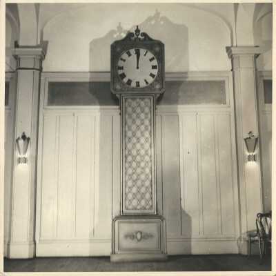 66: Photo of large clock, perhaps 20 feet tall. 