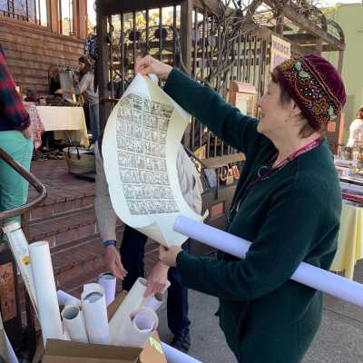 Alice Waters, at her garage sale in front of Chez Panisse