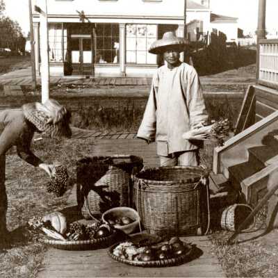 Mrs. Sam Wakeham and Chinese vegetable merchant