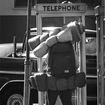 Man at telephone booth.