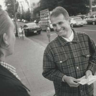 2011.060.459e: Noah Berger, photog. 1996. Speaking with student outside Unit II dorm. 