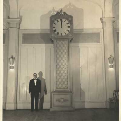 67: Photo of clock with man standing alongside. Is this Bernhardt? 