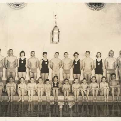 Swim team posed by pool
