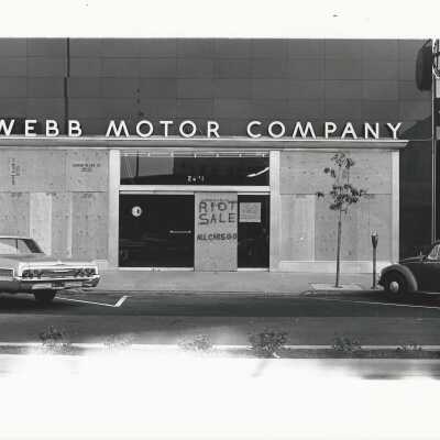 Webb Motor's riot sale [sign on door]