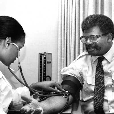Gus Newport having blood pressure checked