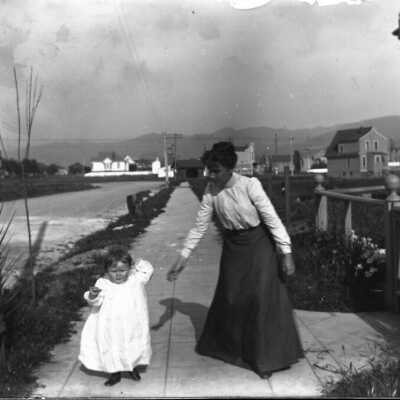 Chester C Post, child, with woman