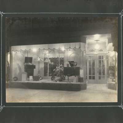 17: Unidentified store front, showing photographs and radios. 