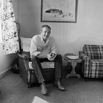 Darrel Coble in his home. On the wall is a painting by a local woman copied from Arthur Rothstein's photograph "Fleeing a dust storm." Cimarron County, Oklahoma.