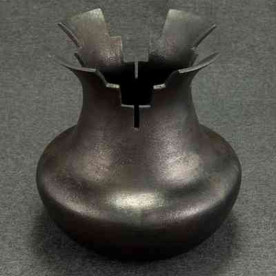 untitled, reduction fired micaceous jar with raincloud motif rim