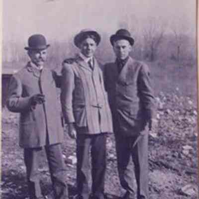 Three Men, 1 in Norfolk Jacket