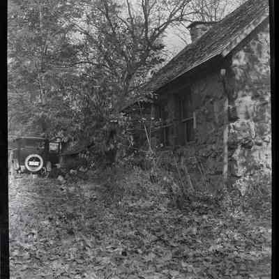 Bailiwick [rear of building w/automobile]