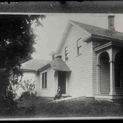 B. [Bailey Homestead- South Haven with Ethel Zoe Bailey on the north porch]