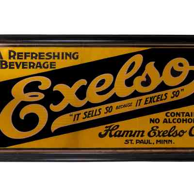 Exelso "It Sells So Because It Excels So" Framed Cardboard Sign