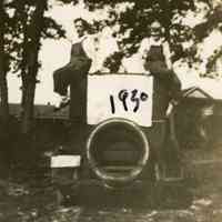 Two women on top of a car