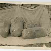 11/1916 Bags in front of crates