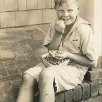 Young Boy Enjoying Blueberries