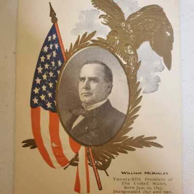 McKinley Postcard with gold eagle, olive branches, and flag