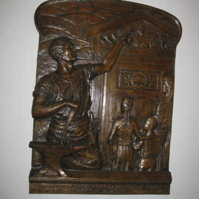 Bronze plaque with worker