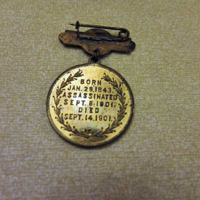 In Memory of Our President brass pin