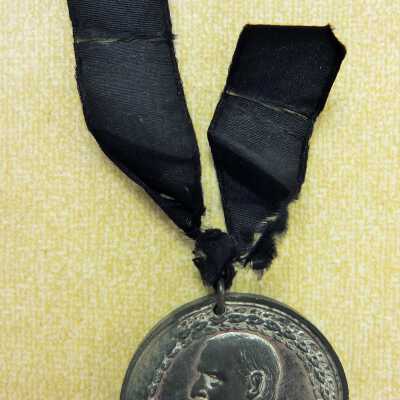 McKinley silver mourning medal with black ribbon