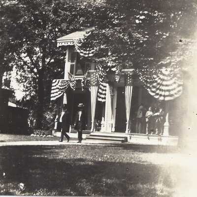 William McKinley walking away from a house.
