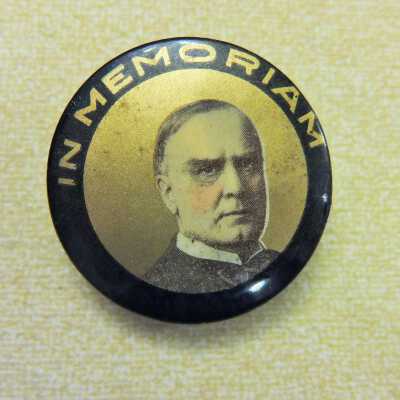 McKinley gold and black In Memoriam 1 1/2" right facing button