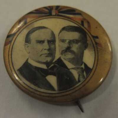 McKinley and Roosevelt pin: circular image on gold with red/white/blue ribbon background