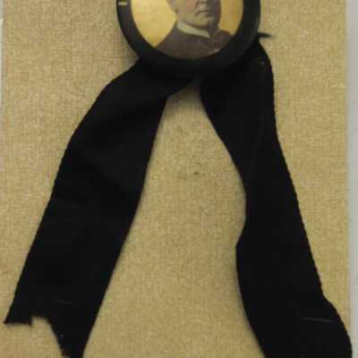 Gold McKinley Memoriam Pin on black ribbon