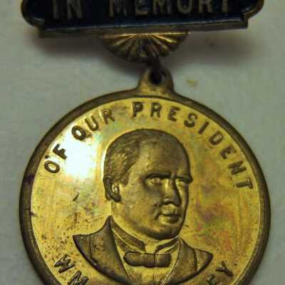 In Memory of Our President brass pin